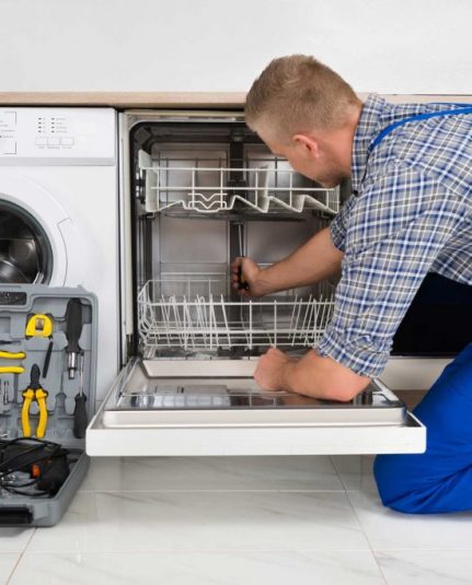 technician fixing a dishwasher repair charleston