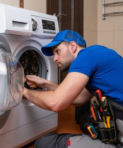 a technician repairing a washer and dryer repair charleston